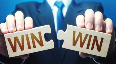 Man holding win win puzzle pieces.
