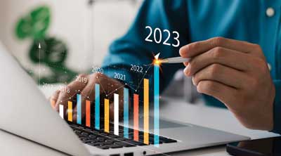 Save Download Preview Businessman analyzes profitability of working companies with digital augmented reality graphics, positive indicators in 2023